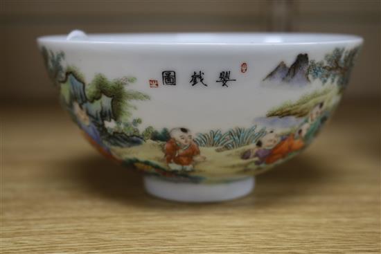 A Chinese porcelain bowl, painted with infants in a landscape, diam. 13.5cm